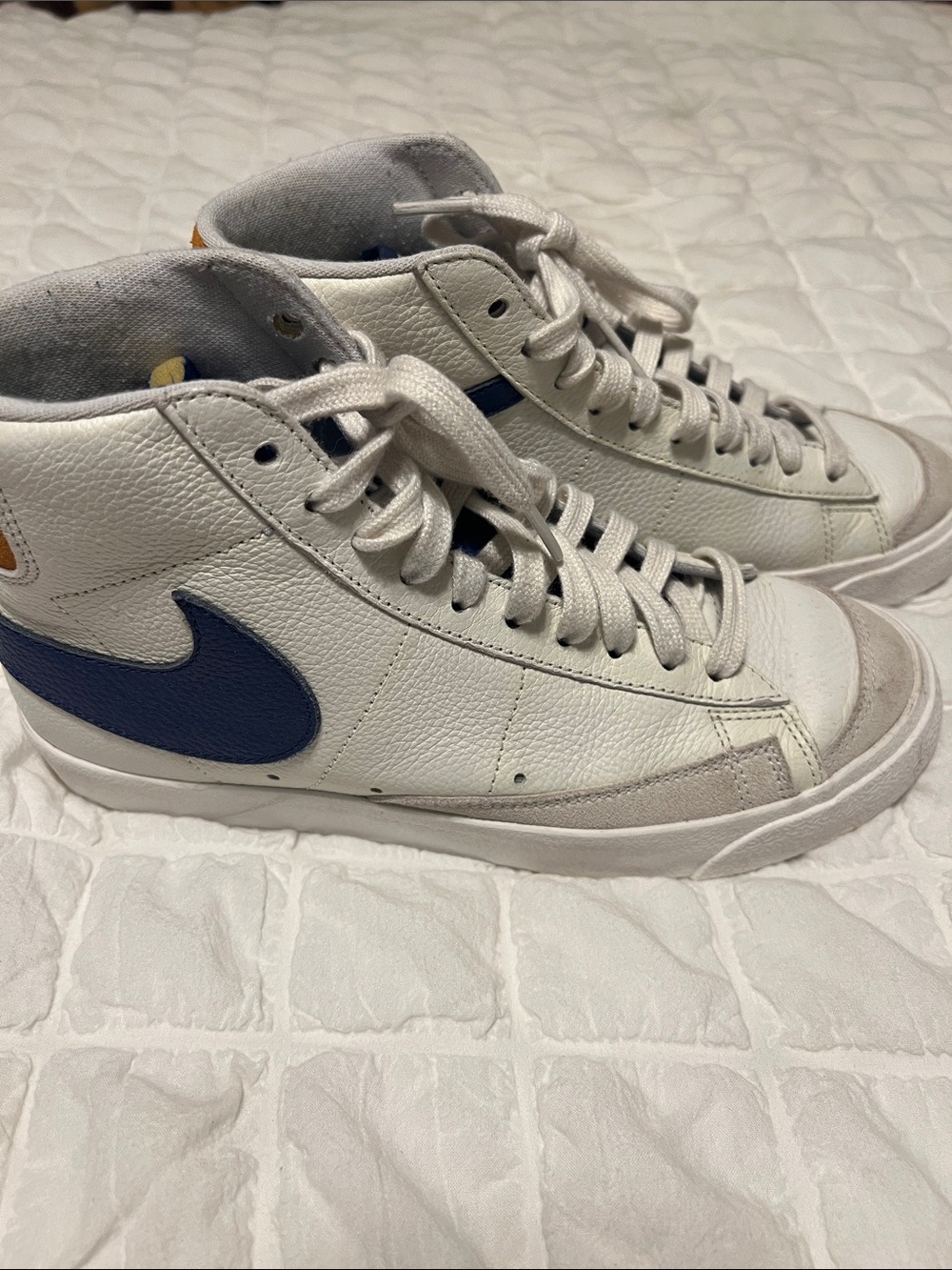 Nike White High-Top Sneakers with Blue Swoosh and Tan Heel Tab